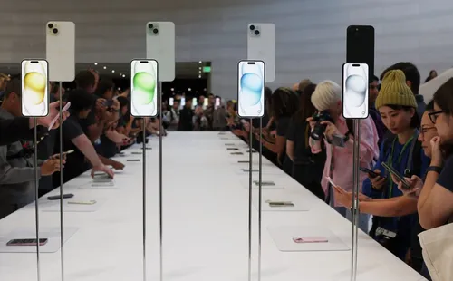 CUPERTINO, CALIFORNIA – SEPTEMBER 12:  Attendees look at brand new Apple products during an Apple event at the Steve Jobs Theater at Apple Park on September 12, 2023 in Cupertino, California. Apple revealed its lineup of the latest iPhone 15 versions as well as other product upgrades during the event. (Photo by Justin Sullivan/Getty Images)