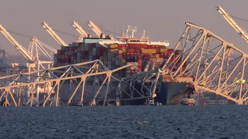 BALTIMORE, MARYLAND - MARCH 26: A cargo ship is shown after running into and collapsing the Francis Scott Key Bridge on March 26, 2024 in Baltimore, Maryland. Rescuers are searching for at least seven people, authorities say, while two others have been pulled from the Patapsco River. (Photo by Rob Carr/Getty Images)