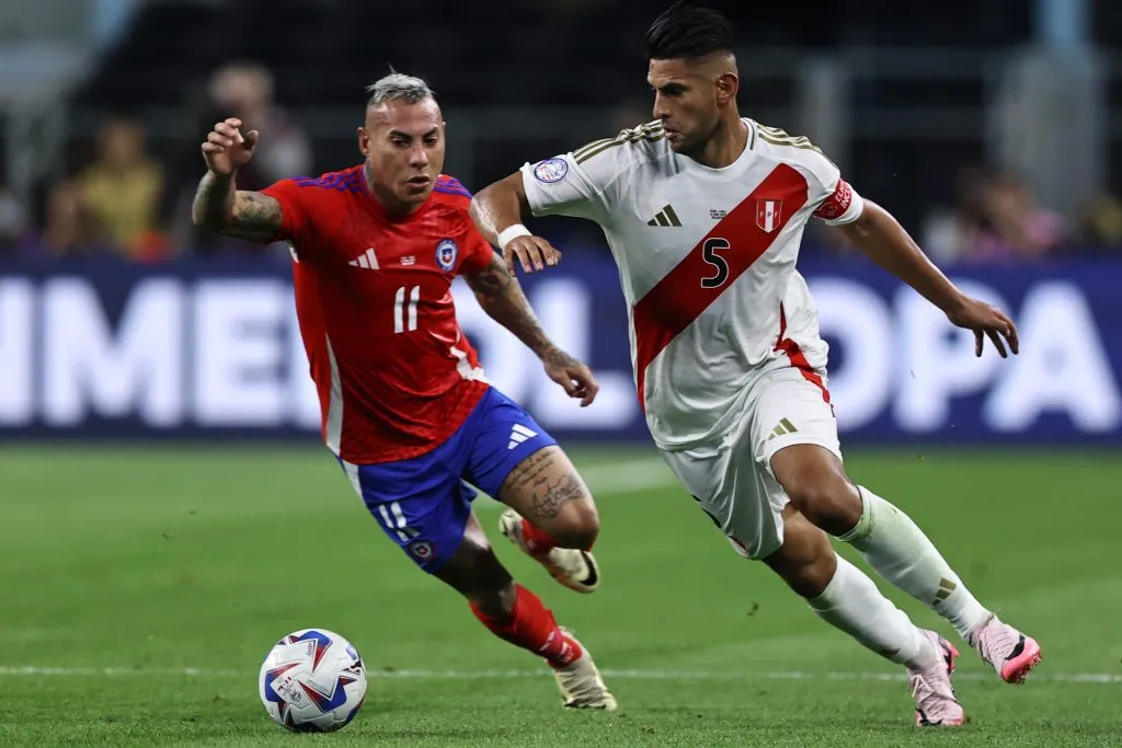 ARLINGTON, TEXAS – JUNE 21: Carlos Zambrano of Peru and Eduardo Vargas of Chile battle for the ball during the CONMEBOL Copa America 2024 Group A match between Peru and Chile at AT&amp;T Stadium on June 21, 2024 in Arlington, Texas. (Photo by Omar Vega/Getty Images)