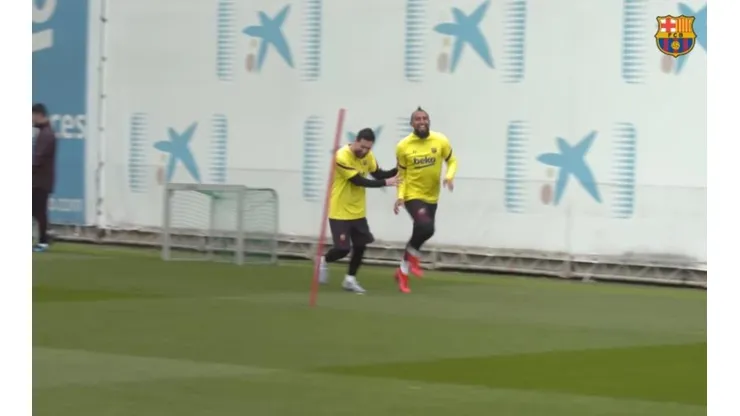 Vidal y Messi en el entrenamiento del Barça.