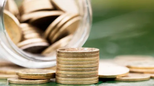 Retirement income concept - gold money coins