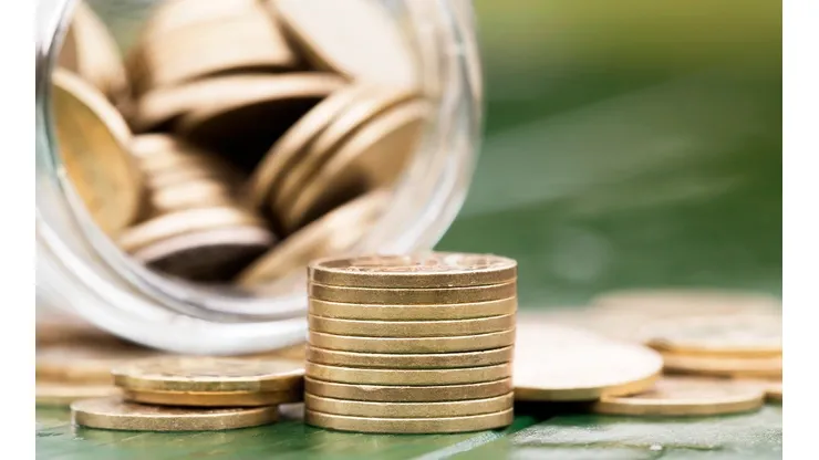 Retirement income concept - gold money coins