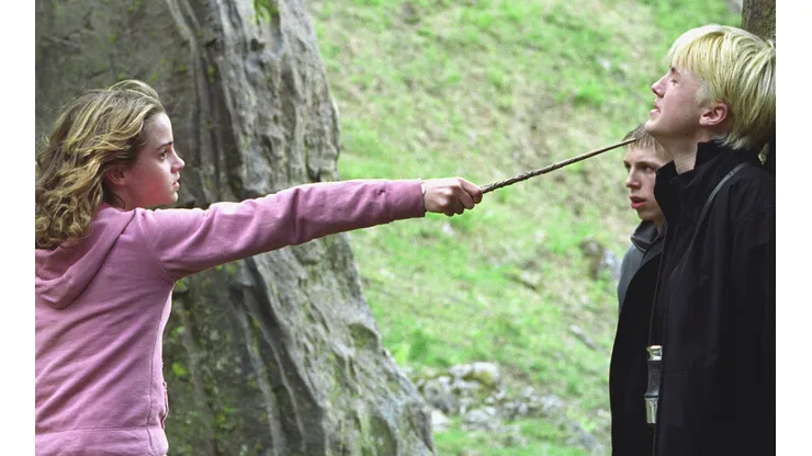 Watson y Felton interpretando a Hermione y Draco en Harry Potter.