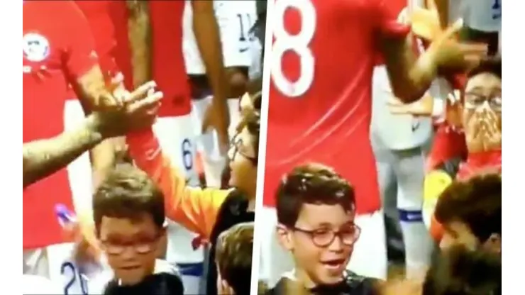 Arturo Vidal saludando a un niño antes de jugar ante Japón