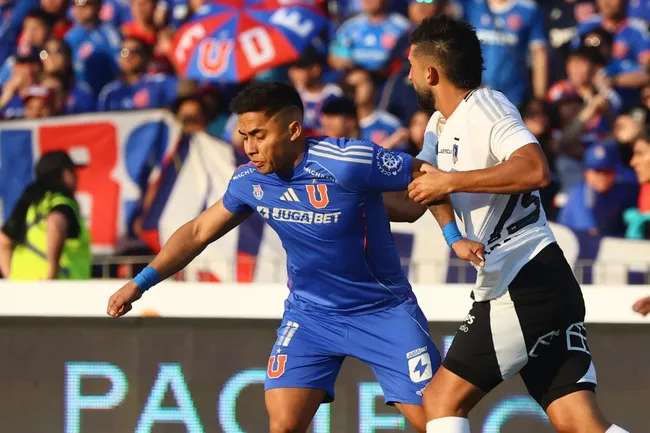 Emiliano Amor frente a Nicolás Guerra: el “15” no podrá jugar ante la U. (Jonnathan Oyarzun/Photosport).