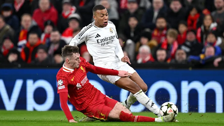 LIVERPOOL, ENGLAND - NOVEMBER 27: Kylian Mbappe of Real Madrid is challenged by Conor Bradley of Liverpool during the UEFA Champions League 2024/25 League Phase MD5 match between Liverpool FC and Real Madrid C.F. at Anfield on November 27, 2024 in Liverpool, England. (Photo by Justin Setterfield/Getty Images)