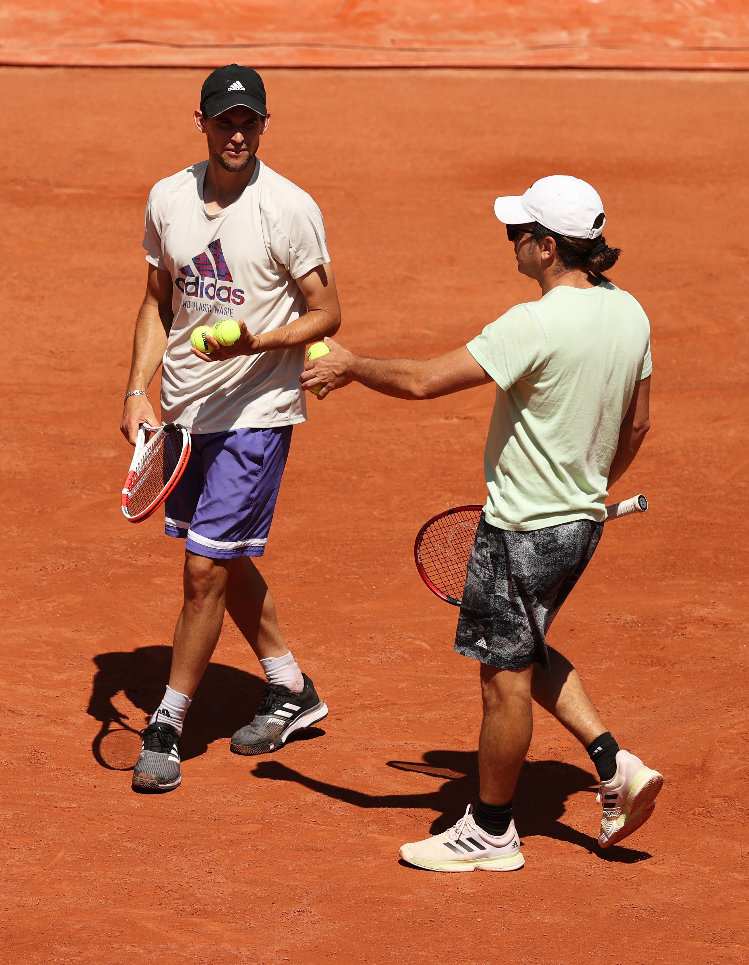 Dominic Thiem entrenando con Nicolás Massú.  (Photo by Clive Brunskill/Getty Images)