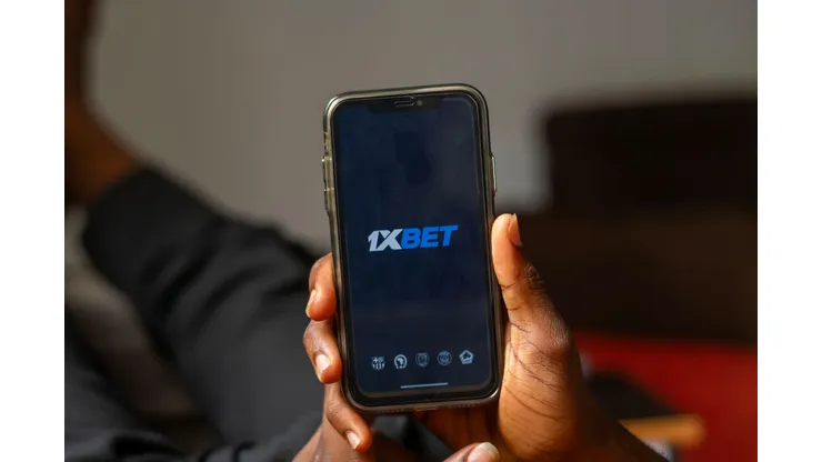 2X5A3R9 FCT Abuja, Nigeria - May 8 2024: 1xBet betting app logo on the display mobile phone