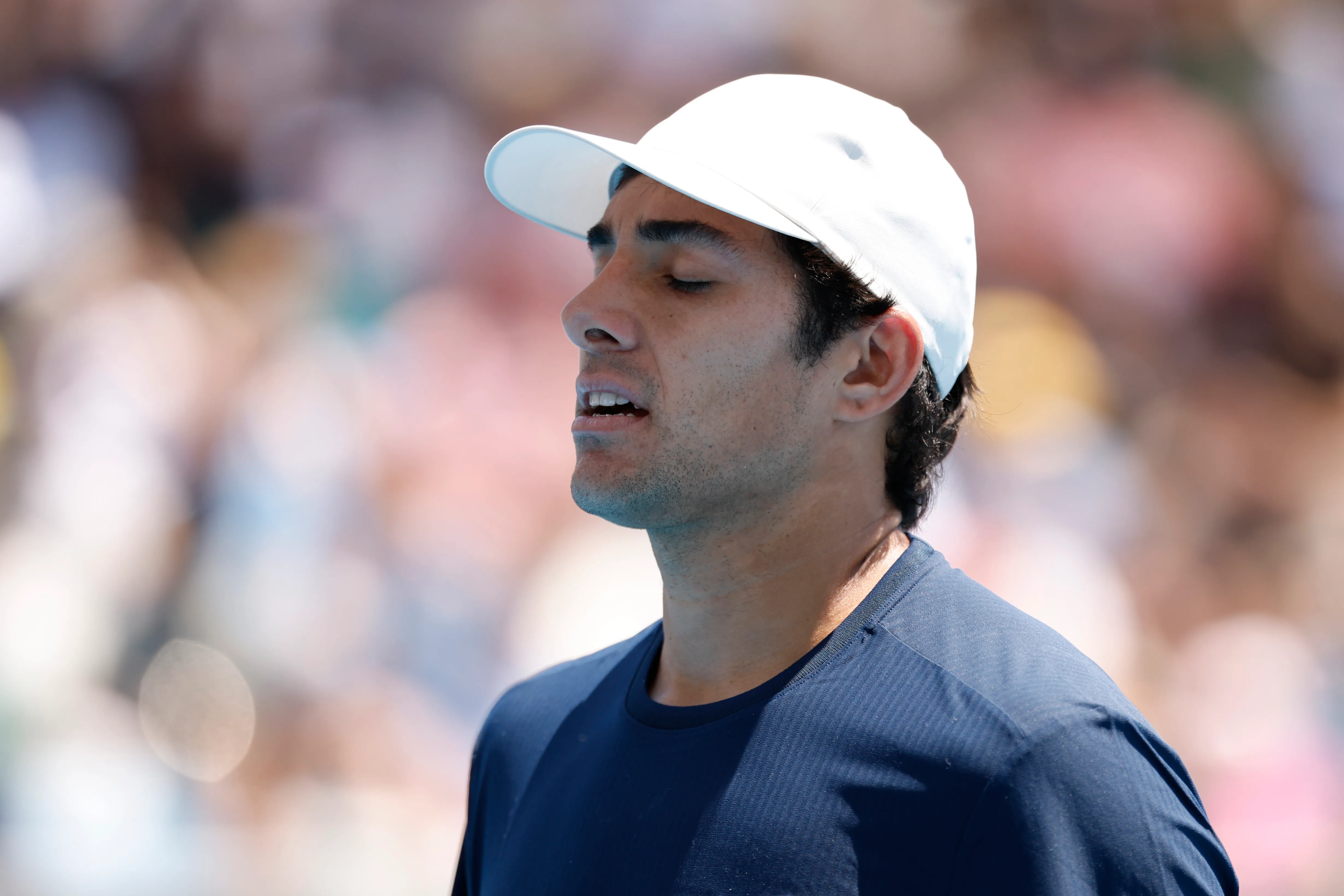 MELBOURNE, AUSTRALIA – JANUARY 20: Cristian Garin of Chile reacts in the Men’s Singles First Round against Luciano Darderi of Italy during day three of the 2026 Australian Open at Melbourne Park on January 20, 2026 in Melbourne, Australia. (Photo by Darrian Traynor/Getty Images)