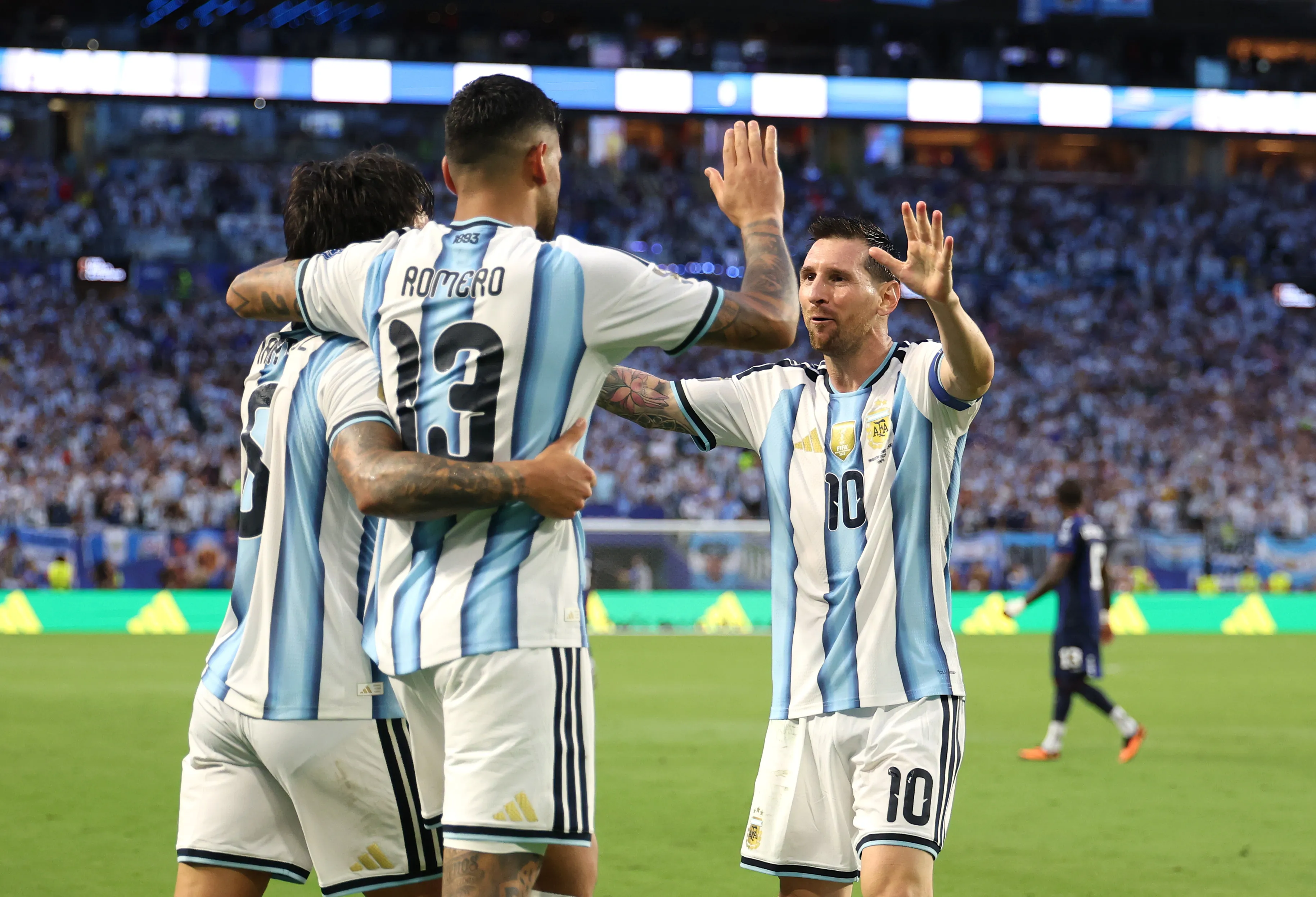MIAMI GARDENS, FLORIDA – JULY 03: Lisandro Martinez #6 of Argentina celebrates with Lionel Messi #10 and Cristian Romero #13 after scoring the team’s second goal during the FIFA World Cup 2026 Round of 32 match between Argentina and Cabo Verde at Miami Stadium on July 03, 2026 in Miami Gardens, Florida. (Photo by Michael Reaves/Getty Images)